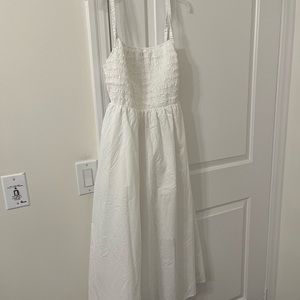 Beautful white large dress also fits XL cut out back